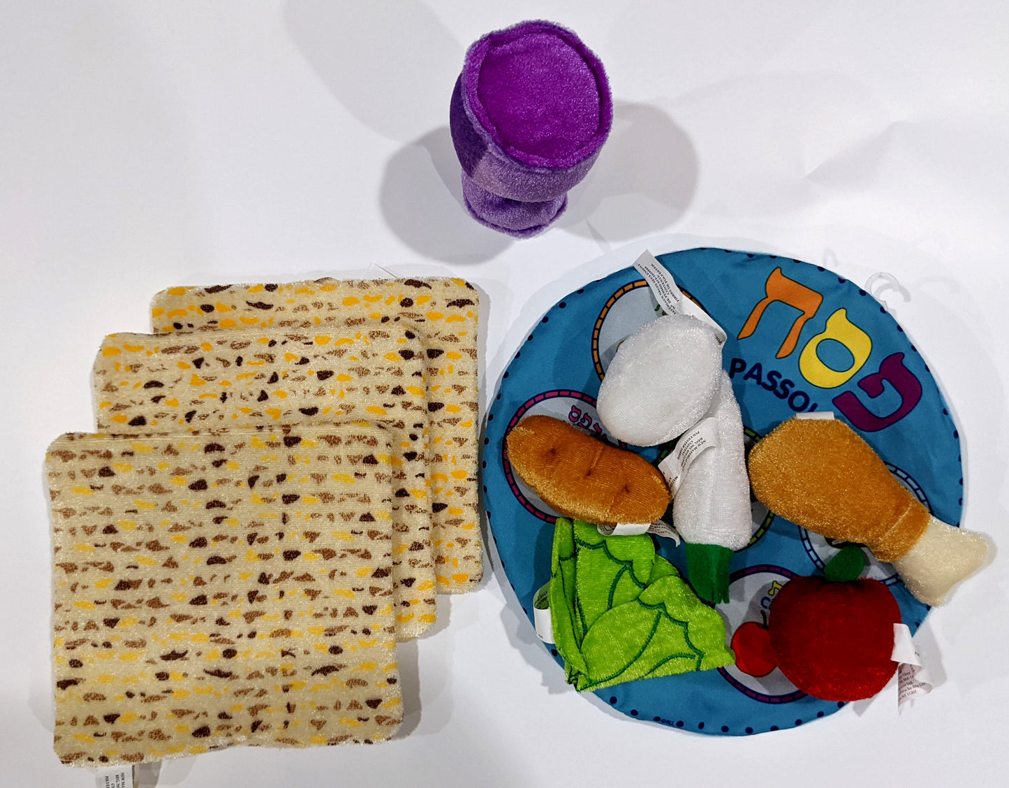 Plush Soft Seder Set with symbolic Passover foods, including egg, shank bone, maror, charoset, karpas, and chazeret.