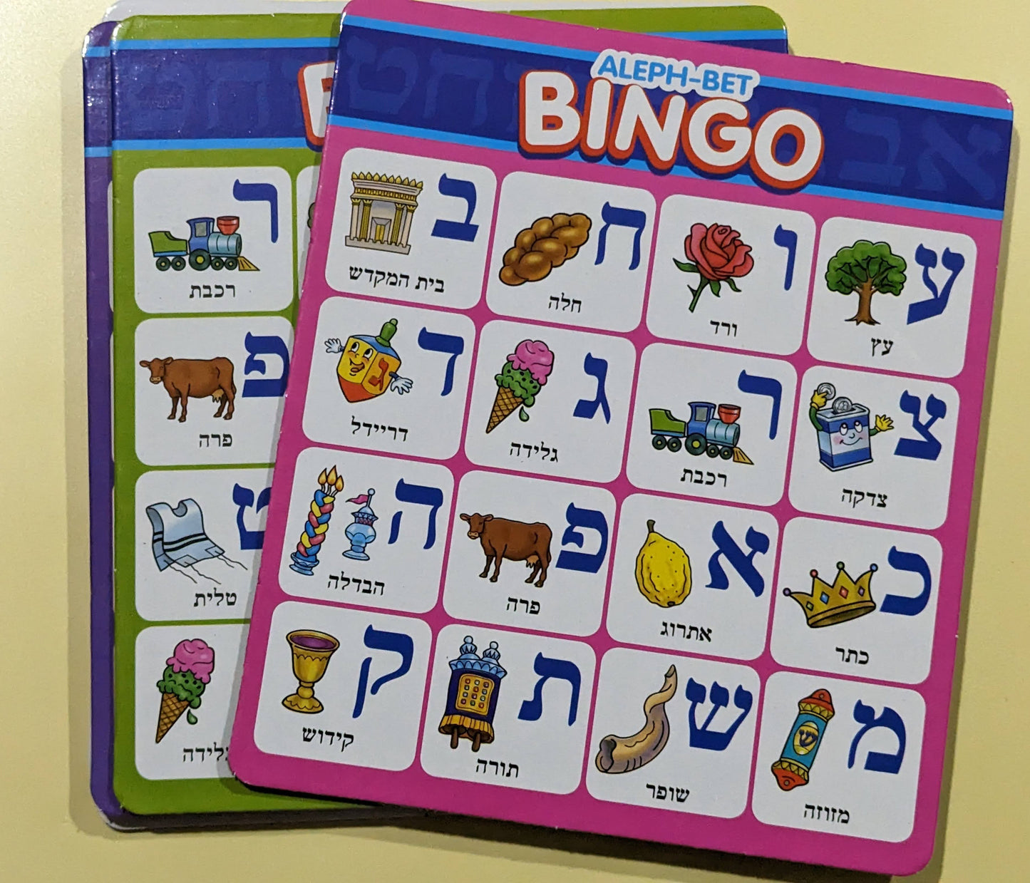 Aleph Bet Bingo game with colorful letters and objects on double-sided playing boards.